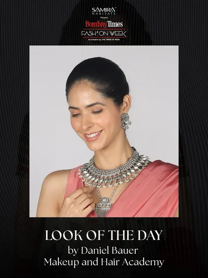 Presenting the official "Look of the Day" from Bombay Times Fashion Week, created by our academy. This look features a radiant smile, elegant silver jewelry, and a clean, polished makeup finish.