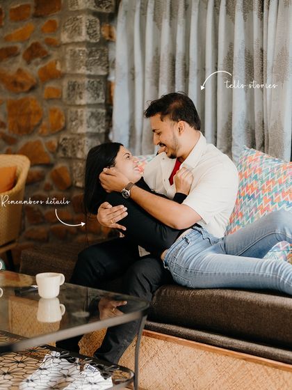 He remembers details, she tells stories. This candid shot on the sofa shows their dynamic, capturing a moment of shared conversation and affection.