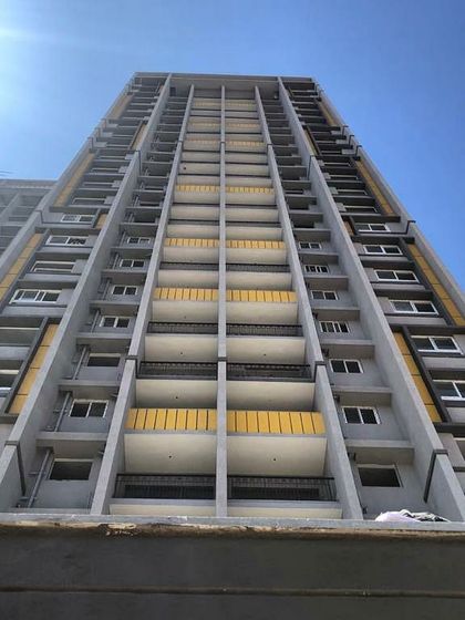 A low-angle view of the apartments on Tumkur Road, Bangalore.