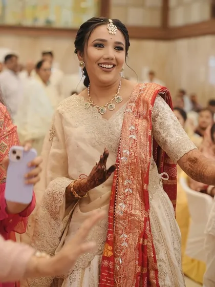 A candid moment of the bride dancing and enjoying her ceremony.