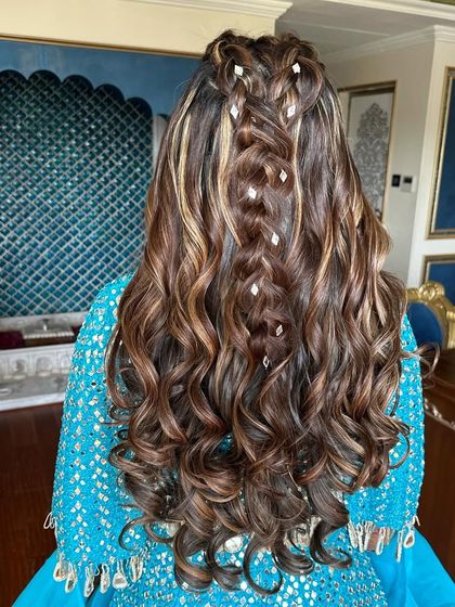 A detailed shot of the braided half-up style with small accessories.