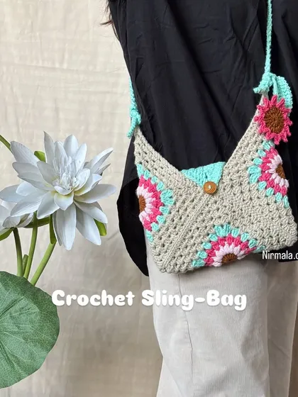 We designed this unique pastel sling bag for those who love a touch of vintage charm. The envelope-like shape is a fun twist on a classic, and the floral granny squares add a soft, delicate feel.