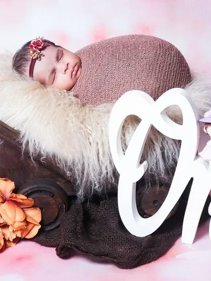 I also offer props for milestone sessions, like this "One" sign used for a baby's first birthday photoshoot. Please inquire for details on milestone packages.