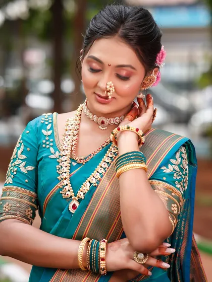 The complete look for our Maharashtrian bridal demo. This shows how the makeup, hairstyle, and traditional jewelry come together for a timeless and elegant result.