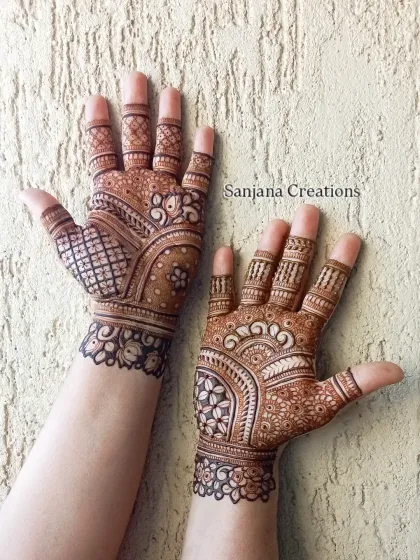A classic, full-hand design perfect for Karwachauth or any festive occasion, featuring a mix of traditional patterns.