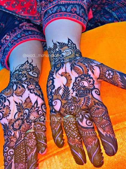 A close-up of a party design, showing the intricate details of the peacock and floral patterns.