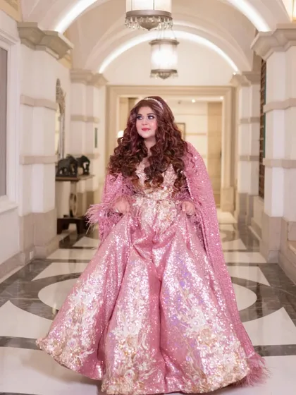Another shot of my reception look. I wanted something that was pure glamour and fantasy, and this sequined gown with a feathered cape was a dream come true.
