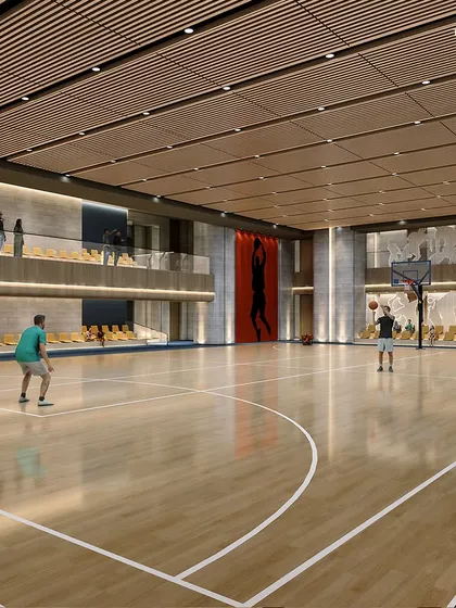 A state-of-the-art indoor basketball court within a new sports club. The facility is designed for both intense competition and relaxed fun, with a wood-paneled ceiling and large graphic art adding to the dynamic atmosphere.