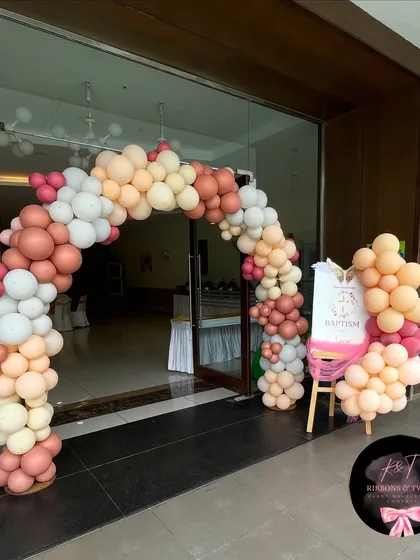 The entrance to the venue, where our balloon arch and personalized welcome sign set a celebratory and elegant tone for the baptism event.