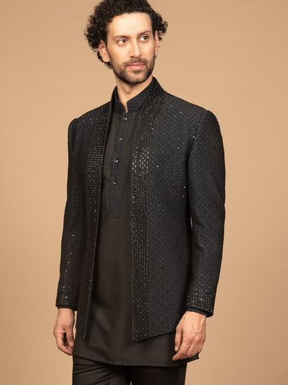 This black designer embroidered Bandhgala jacket and kurta set exudes sophistication. The intricate embroidery elevates the style, making it perfect for any formal event.
