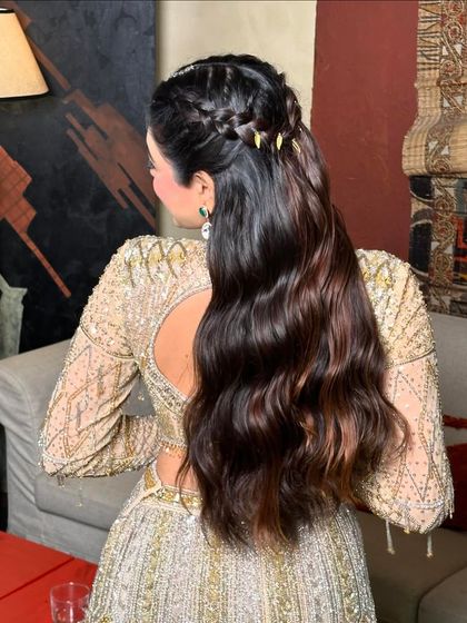 The back view of this hairstyle shows how a simple braid can elevate a half-up look, adding texture and interest.