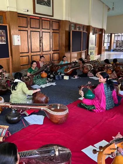 Here we are, deep in preparation for a massive 50-member veena ensemble concert. I lead these interactive workshops where musicians of all levels come together to learn and create something beautiful as a group.