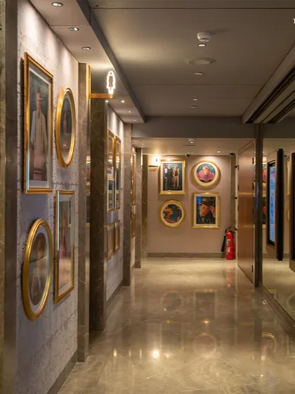 The majestic lobby of Maison INOX at Jio World Centre, known as ‘The Galleria’. A pristine blend of white and black marble with brass accents and dramatic art deco details echoes the golden age of cinema, making every visit an immersive experience.