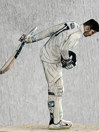 A close-up of the hand-painted cake topper we made for cricketer Shubman Gill's birthday. Our artist did an incredible job capturing his iconic pose.