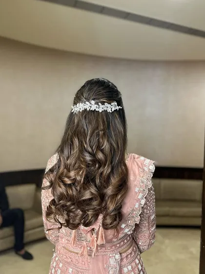 A slightly different angle of the half-up reception look, showing the beautiful texture of the curls.