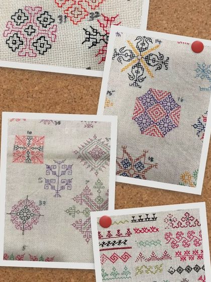 A collage of Kasuti samples pinned to a board. This is a great way to keep track of different motifs and color ideas, and it shows the creative possibilities of hand embroidery.