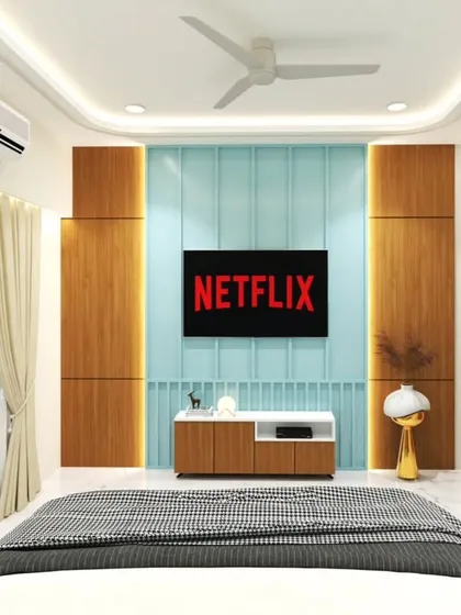 A fun and modern bedroom TV wall, featuring a light blue panel and wood accents. This design is perfect for adding a pop of color to a room.