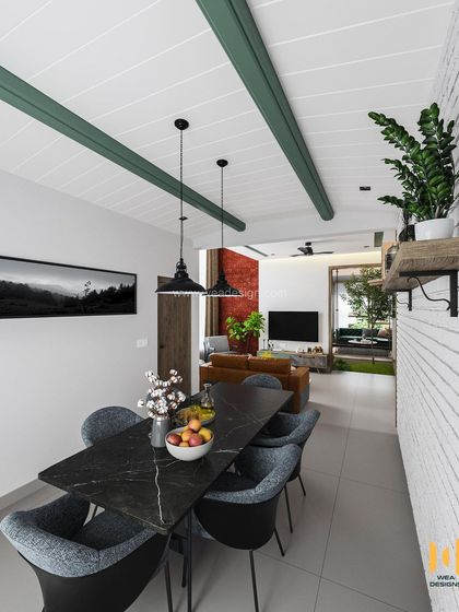 A modern duplex in Calicut with a Scandinavian color palette, featuring a black marble dining table and a striking white brick wall.