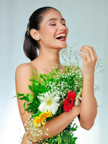 A moment of pure laughter. This candid-style shot is perfect for showing personality and a natural, joyful side in a portfolio.