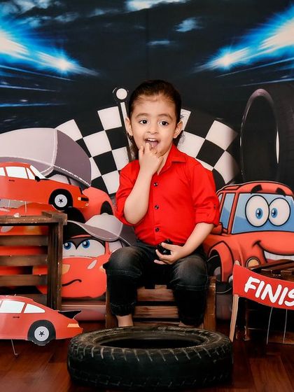A thoughtful moment during the "Cars" themed shoot. Even in a high-energy setup, I look for those quiet moments that reveal your child's personality.