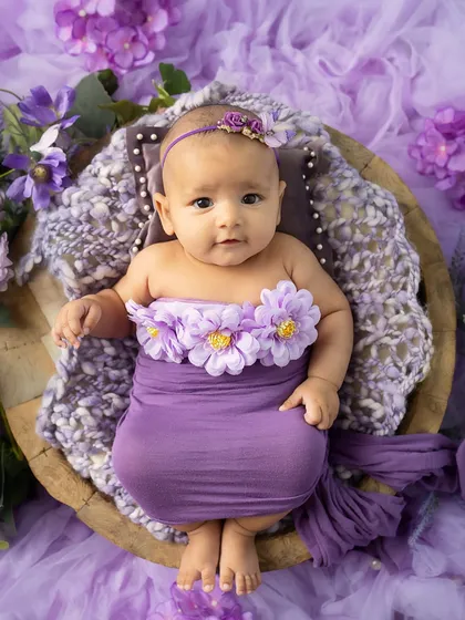 A perfect little package. This overhead shot shows the full floral setup, with the baby as the beautiful centerpiece.