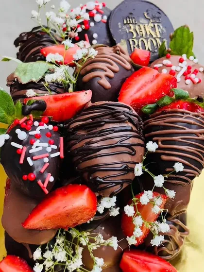 A close-up of our Dipped Chocolate Strawberry Cube. Each strawberry is dipped in rich chocolate and decorated with drizzles and sprinkles, then arranged into a beautiful, modern dessert sculpture.