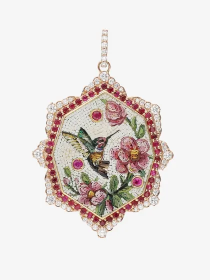 The romantic connection between hummingbirds and flowers is like poetry. This pendant captures that passion with rubies from Gemfields inlaid in a vibrant micromosaic pattern.