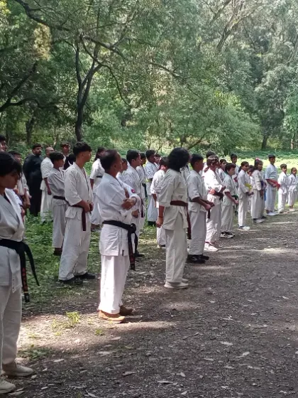 The entire group lined up and ready for practice in the forest. This image shows the scale of our camp and the discipline of our students.