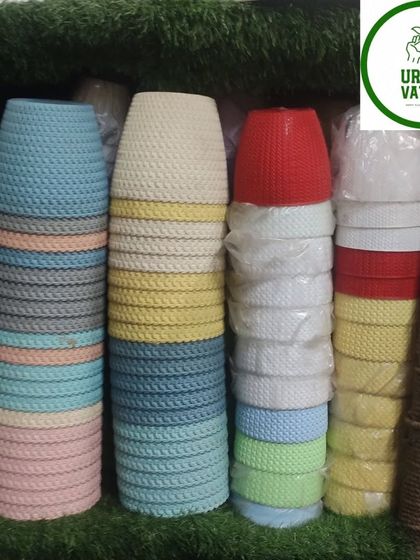 Stacks of colourful, textured plastic pots.