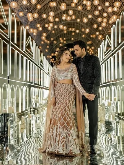 For Pranavi and Labhya's cocktail night, we created an atmosphere of pure glamour. Her shimmering lehenga and his sleek, modern suit were styled to complement each other perfectly, creating a powerful look for a night of celebration under a tunnel of lights.