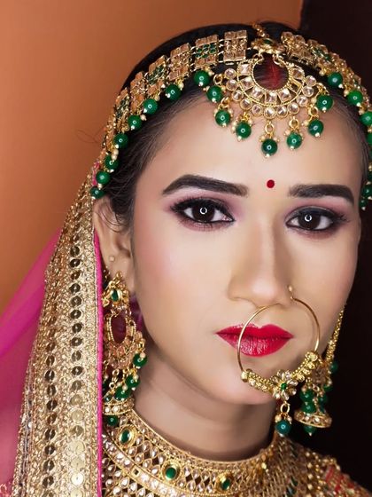 A powerful portrait of the bride, looking directly at the camera. Her makeup is bold and captivating.
