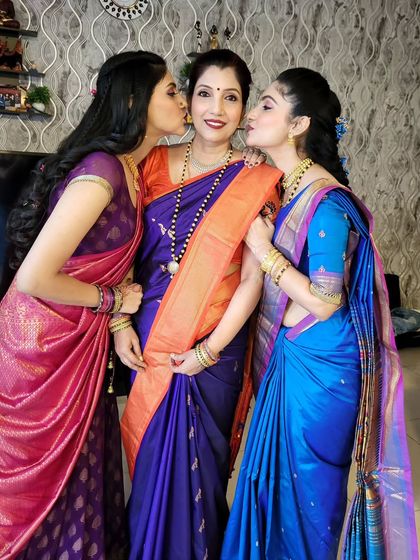 A heartwarming picture of a mother and her two daughters, all draped by me. I styled each of them to suit their individual personalities and sarees.