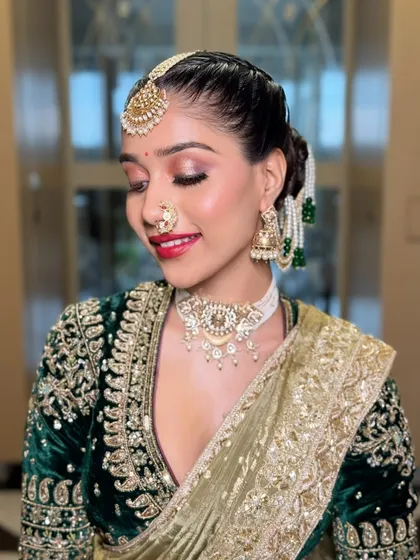 A beautiful, smiling portrait of the bride. This shot captures the joy and elegance of the Maharashtrian look, with the shimmering eyeshadow and radiant skin catching the light perfectly.