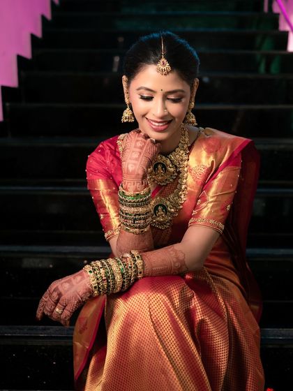 A beautiful candid shot of the bride. The soft, glowing makeup enhances her features and gives her a flawless complexion that looks stunning on camera.