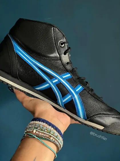 May the Force be with your feet. These Onitsuka Tiger high-tops were customized with a Star Wars dark side theme, featuring Darth Vader.