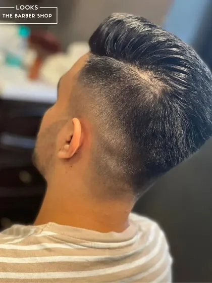 The back and side view of a taper fade, showing how we meticulously blend the hair for a natural yet sharp finish.