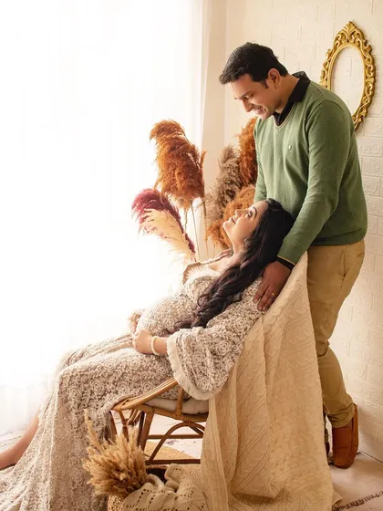 A cozy and romantic maternity session with a boho feel. The lace dress and warm, natural light create a very relaxed and intimate atmosphere.