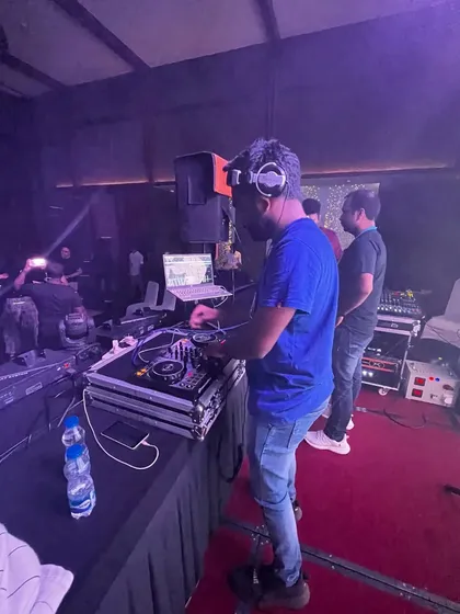 Focused on the mix during a private event. I use professional-grade Pioneer equipment to deliver a clean, powerful sound for any venue.