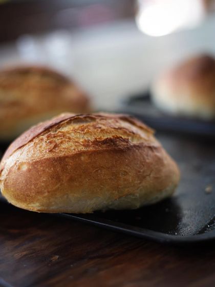 The beautiful crust on our homemade bread rolls. Learning to bake bread is a deeply rewarding skill.