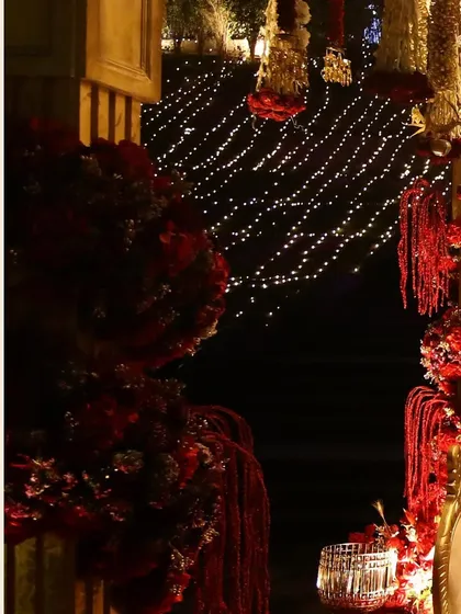 A detail shot of the floral arrangements and fairy lights that created a magical backdrop for the traditional wedding ceremony.