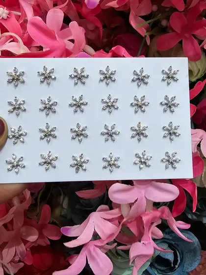 Our beautiful snowflake studs, perfect for adding a touch of winter magic to your look.