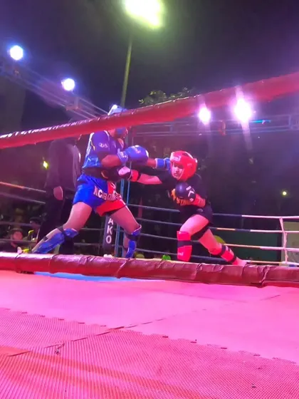 A powerful right hand lands, showcasing the technique and power we build in our women's program.