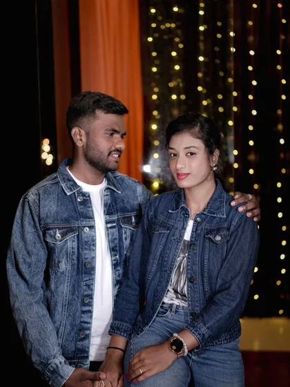 Another relaxed portrait of the couple in denim, showcasing a different angle of our indoor set.