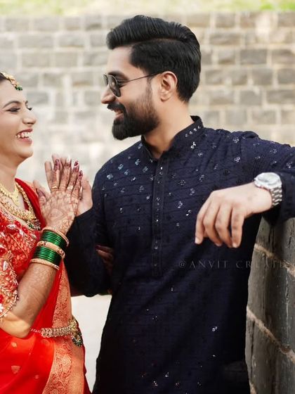 A candid moment of laughter and conversation during an outdoor engagement shoot.