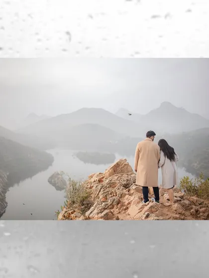 Your love story, set against the epic backdrop of nature. We travel to stunning locations like these misty hills to capture breathtaking portraits. This shot showcases our destination pre-wedding photography, perfect for adventurous couples.