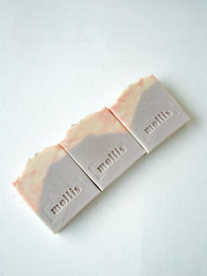 Three Lavender Patchouli bars lined up, each with a unique, subtle pattern.