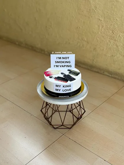 A fun and cheeky vape-themed cake for a loved one. The message "I'm not smoking I'm vaping" adds a personal, humorous touch.