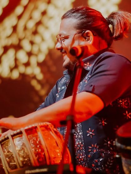 The heart of our rhythm section. A joyful shot of our percussionist on the tabla.