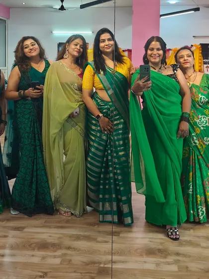Posing for a group photo during our festive Teej gathering. It's moments like these that turn clients into lifelong friends.
