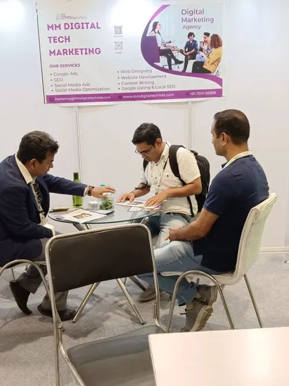 I believe in working directly with my clients. Here I am at a digital marketing event, discussing a business's specific needs and outlining a strategy for their online growth, including SEO and social media ads.